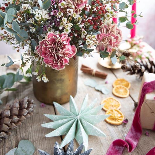 Holiday tablescape accented by frosty winter pastels and a pop of burgundy-pink.