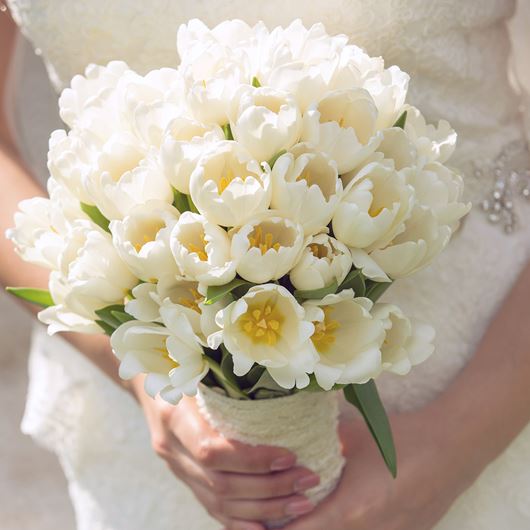 Bridal bouquet featuring white tulips.