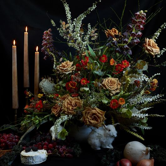 Moody centerpiece invokes elements of still life paintings of the Dutch Golden Age.