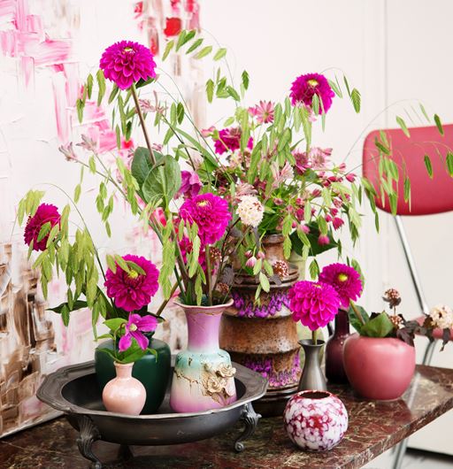 Vintage pewter and ceramics with Briza mazima, Dahlias, and Clematis. Photo: Rolinda Windhorst