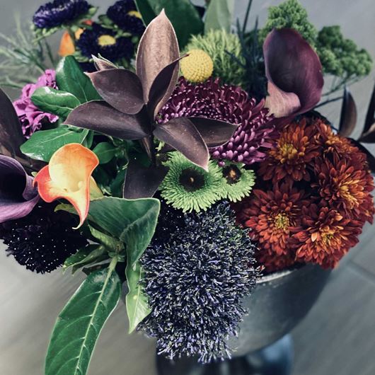 BRUT-inspired arrangement featuring assorted mums, callas and Asters.