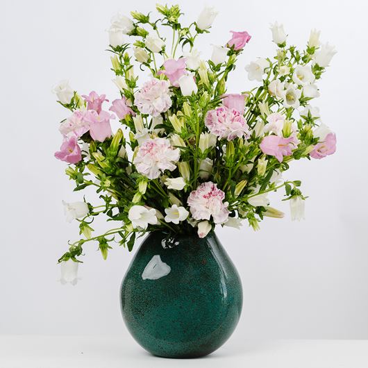Pink and white Campanula are the stars of this springtime arrangement.