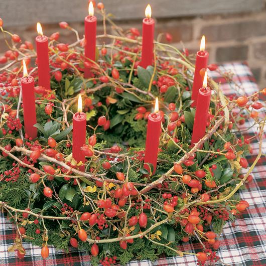 Holiday wreath centerpiece featuring Skimmia, rose hips and winterberries.