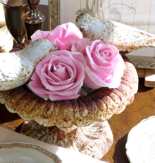 ‘Rosita Vendela’ roses in a miniature weather-aged urn.