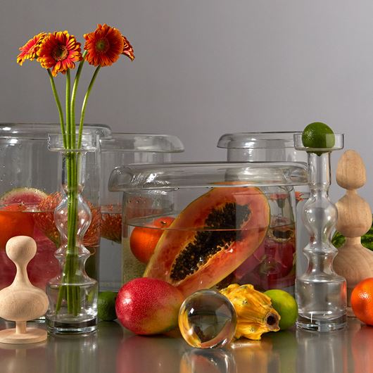 Tablescape using assorted fruits and mini Gerberas.