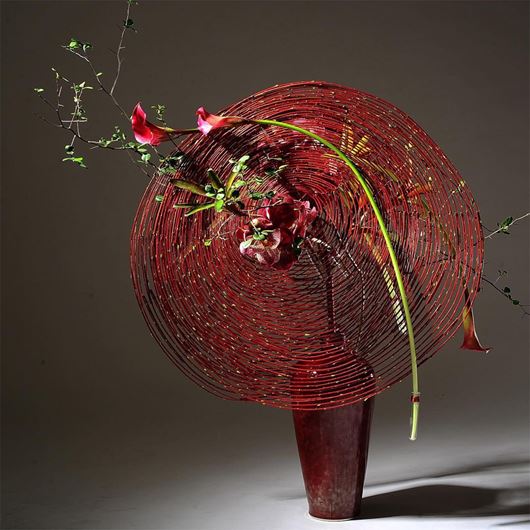Graduated red willow and double disc design for the American Floral Art School.