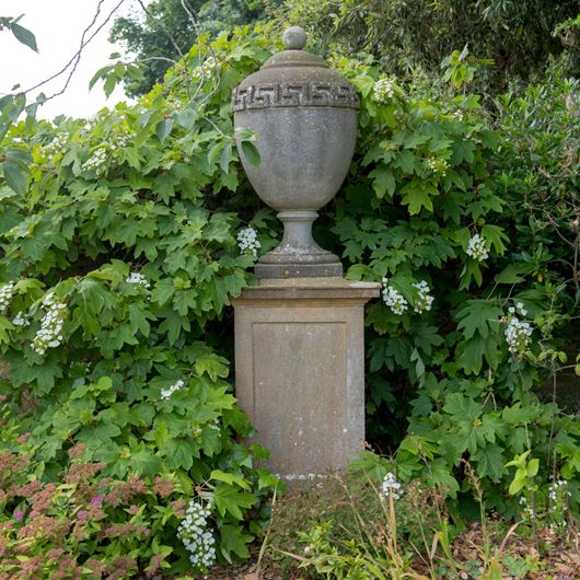 Stone urn in a country cottage.