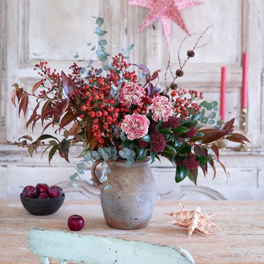 Pastel pinks and frosty blues serve as perfect complements to winter berries and foliage.