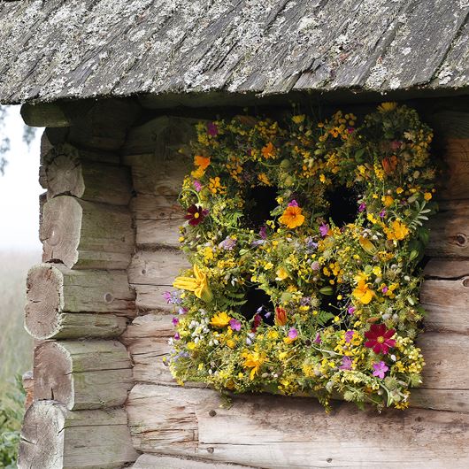 Floral window frame constructed of assorted botanicals.