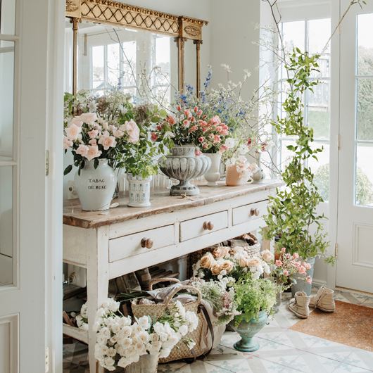 Lucy's porch often becomes a place to condition the flowers she's brought home or cut from the garden.