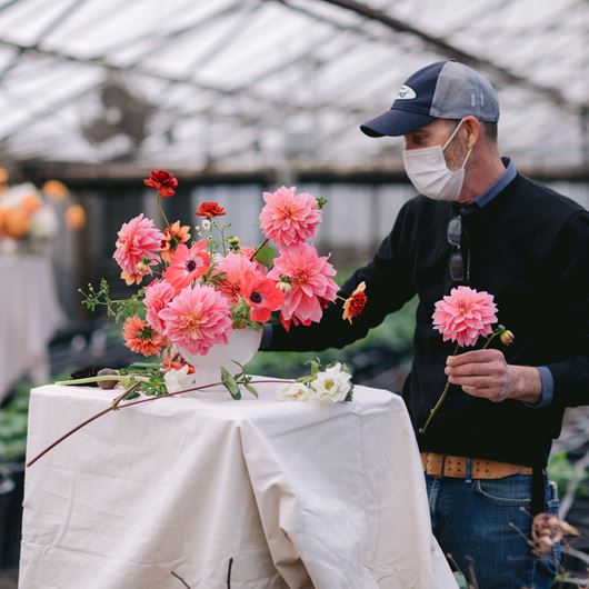 TJ McGrath designs an arrangement using locally grown Dahlias, Ranunculus and Anemones.