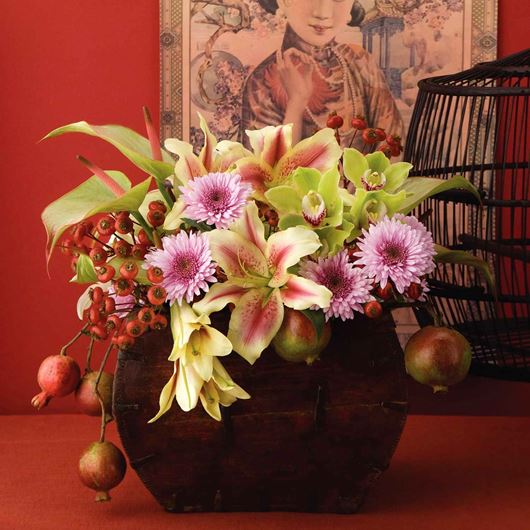 "Oriental-inspired" arrangement featuring pink mums, oriental lilies, orchids and Anthurium.