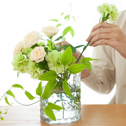 Modest floral decor featuring spray roses and carnations.