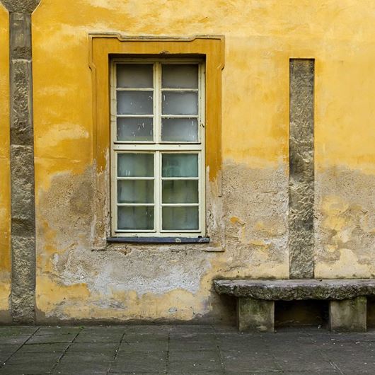 Grays and yellows in rustic architecture.