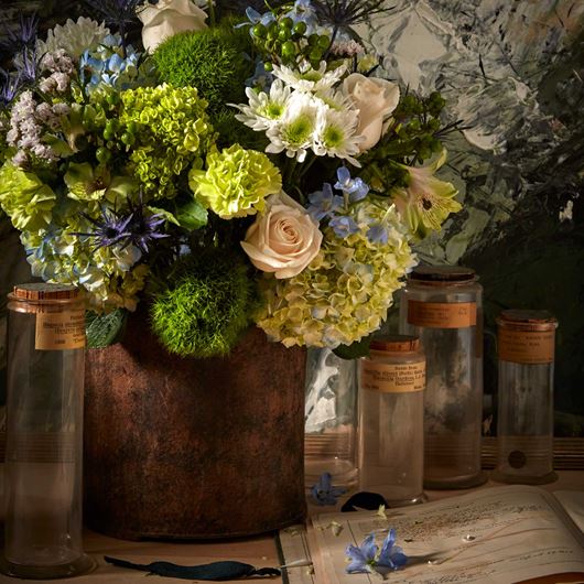 Inspired by the colors of nature, this centerpiece features assorted Hydrangea, roses, Hypericum, Eryngium and mums.