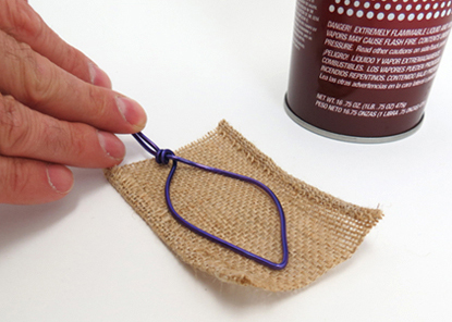 Press the wire onto a piece of burlap cloth